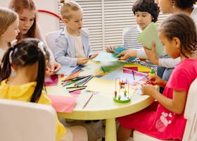 Children engaged in creative activities during an art class at a preschool, fostering learning and fun.